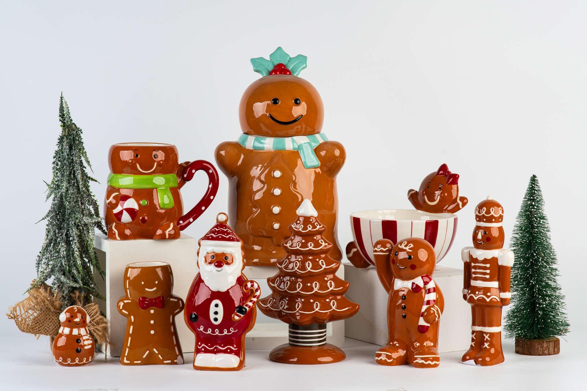 Original collection photograph: Tall gingerbread figure with mint scarf, Santa, soldier, brown tree, striped bowl and character mug