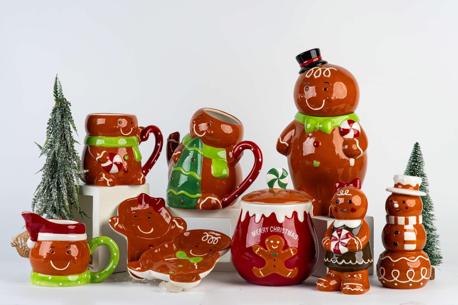 Original collection photograph: Gingerbread mugs and character dishes with a tall smiling figure, red canister and two smaller characters