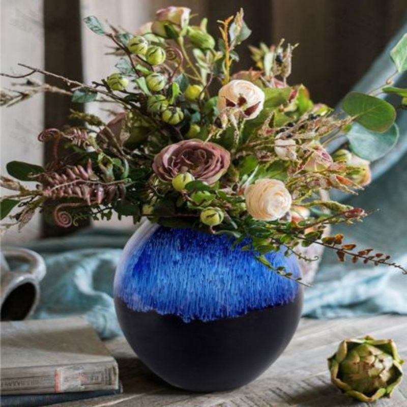 Round blue reactive glaze ceramic vase