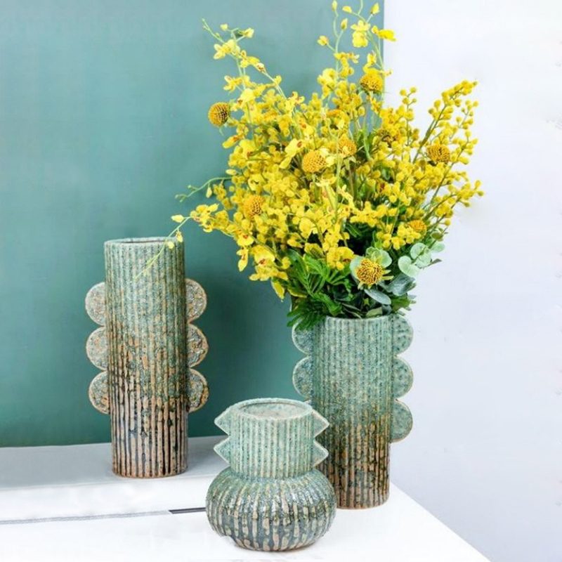 Green sculptural ceramic vases with fin relief