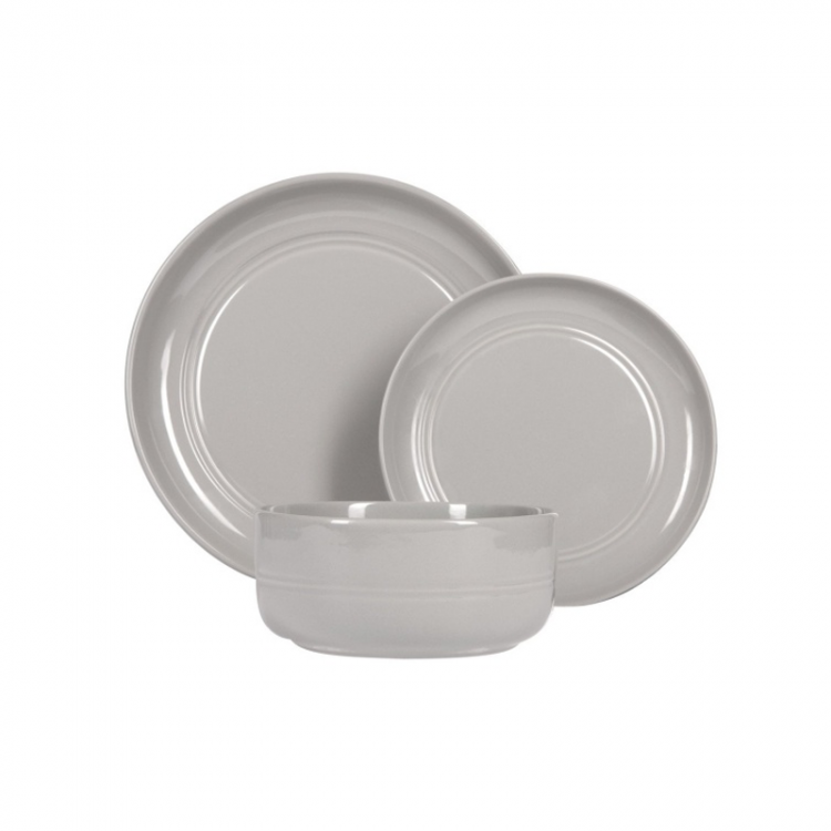 Grey plates and a shallow bowl on a light background