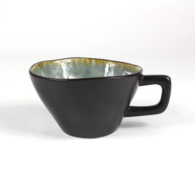 Black stoneware cup with a pale reactive glaze interior